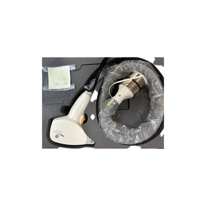 2018 Lumenis LightSheer Desire controller view showing the handpiece and coiled cable packaged with protective plastic wrap