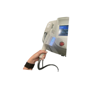 2018 Sciton BBLs controller view showing a hand holding the handpiece with display screen and coiled cable