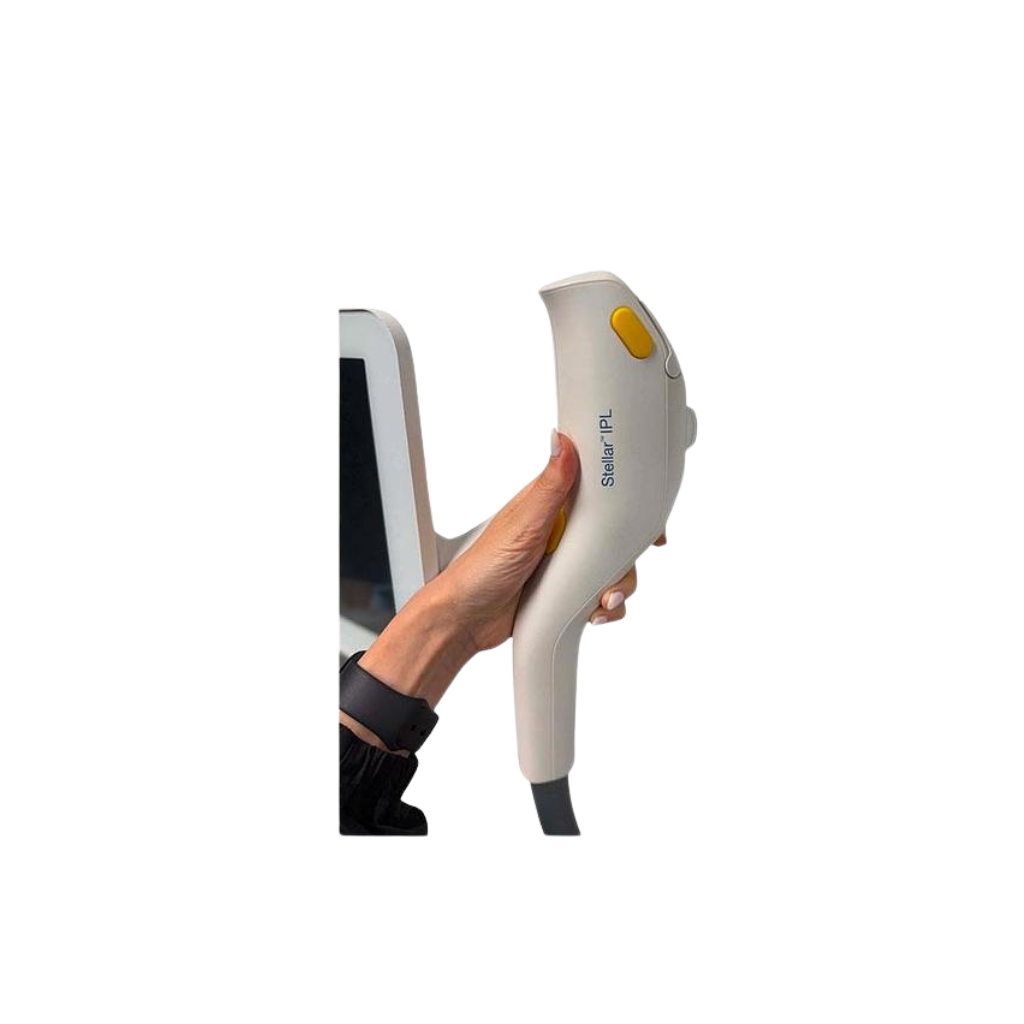 2021 Lumenis Stellar M22 controller view 2 showing a hand holding a treatment handpiece near the display screen