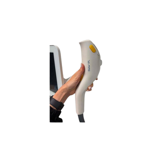 2021 Lumenis Stellar M22 controller view 2 showing a hand holding a treatment handpiece near the display screen