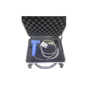 Open case containing a treatment applicator with a blue handle, circular applicator, cable, and accessories.