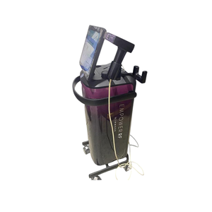Left-side view of the InMode Empower RF treatment system, showing its upright console, display, and attached applicator