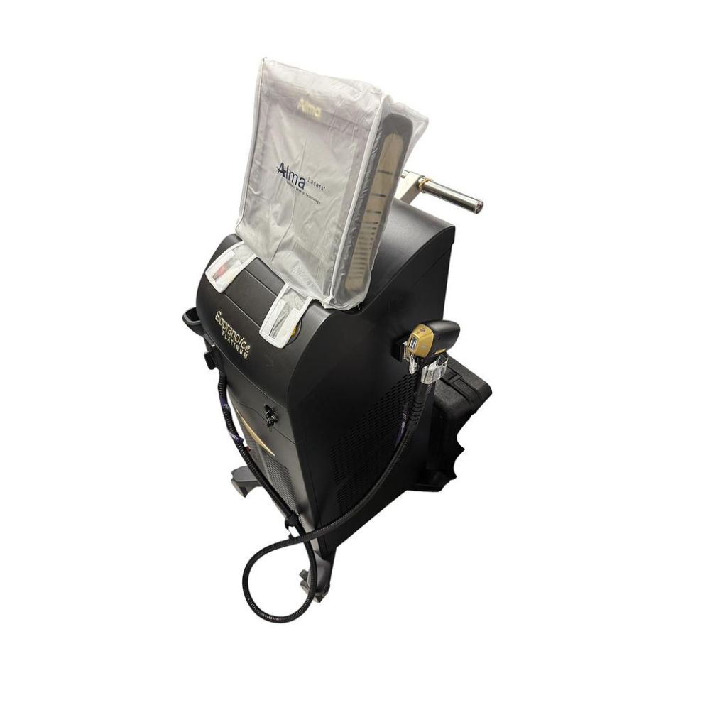 2022 Alma Soprano Console ICE Platinum side view showing the upright body with plastic protective cover and handpiece attached