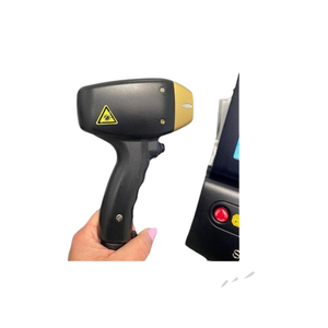 2022 Alma Soprano ICE Platinum controller view showing a hand holding the handpiece with warning label near the device body
