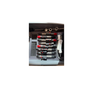 2022 DEKA Motus AZ+ attachments view 2 showing a set of handpieces with red safety keys stored in a foam-lined case
