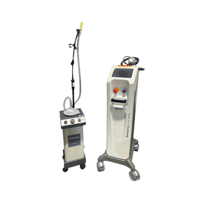 2022 DEKA SmartXide Tetra stand view showing the laser unit positioned beside a separate smoke evacuator with an articulated extraction arm