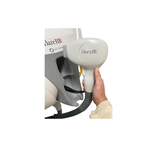 2022 Sciton Bare HR controller view showing a hand holding the handpiece connected to the device body with cable