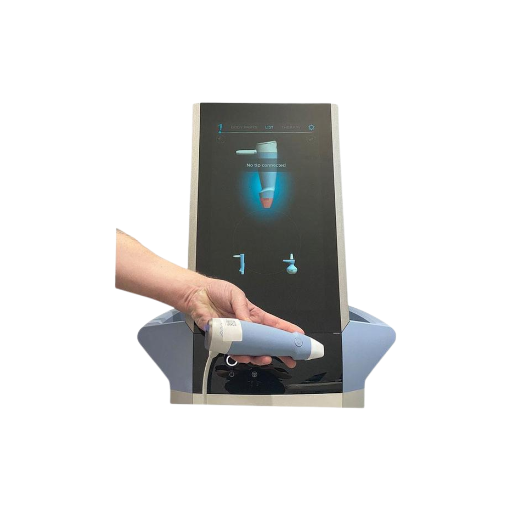 2023 BTL EXION controller view 2 showing a hand holding a treatment handpiece beneath the display screen