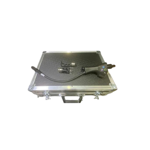 2024 DEKA SmartXide Tetra PRO controller view showing the handpiece and articulated arm packaged in a metal carrying case