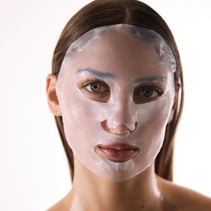 Model wearing a Bionassay Cytogen Masques, an advanced biocellulose recovery masks designed to support skin healing and comfort following professional aesthetic treatments. 