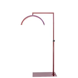 CosmoGlo LED XL light dark cherry with adjustable arm and phone clip, professional illumination tool for med spa injectors and dermatology treatment procedures.