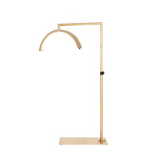 CosmoGlo LED XL light gold with adjustable arm and phone clip, professional illumination tool for med spa injectors and dermatology treatment procedures.