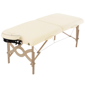 Earthlite Avalon XD Massage Flat Table with Vanilla Creme upholstery for wellness practices.