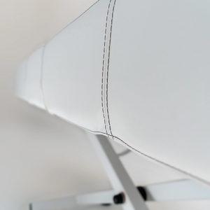Earthlite Ellora LX multi-treatment table upholstery stitching detail showing premium finish for med spa and medical wellness practices.