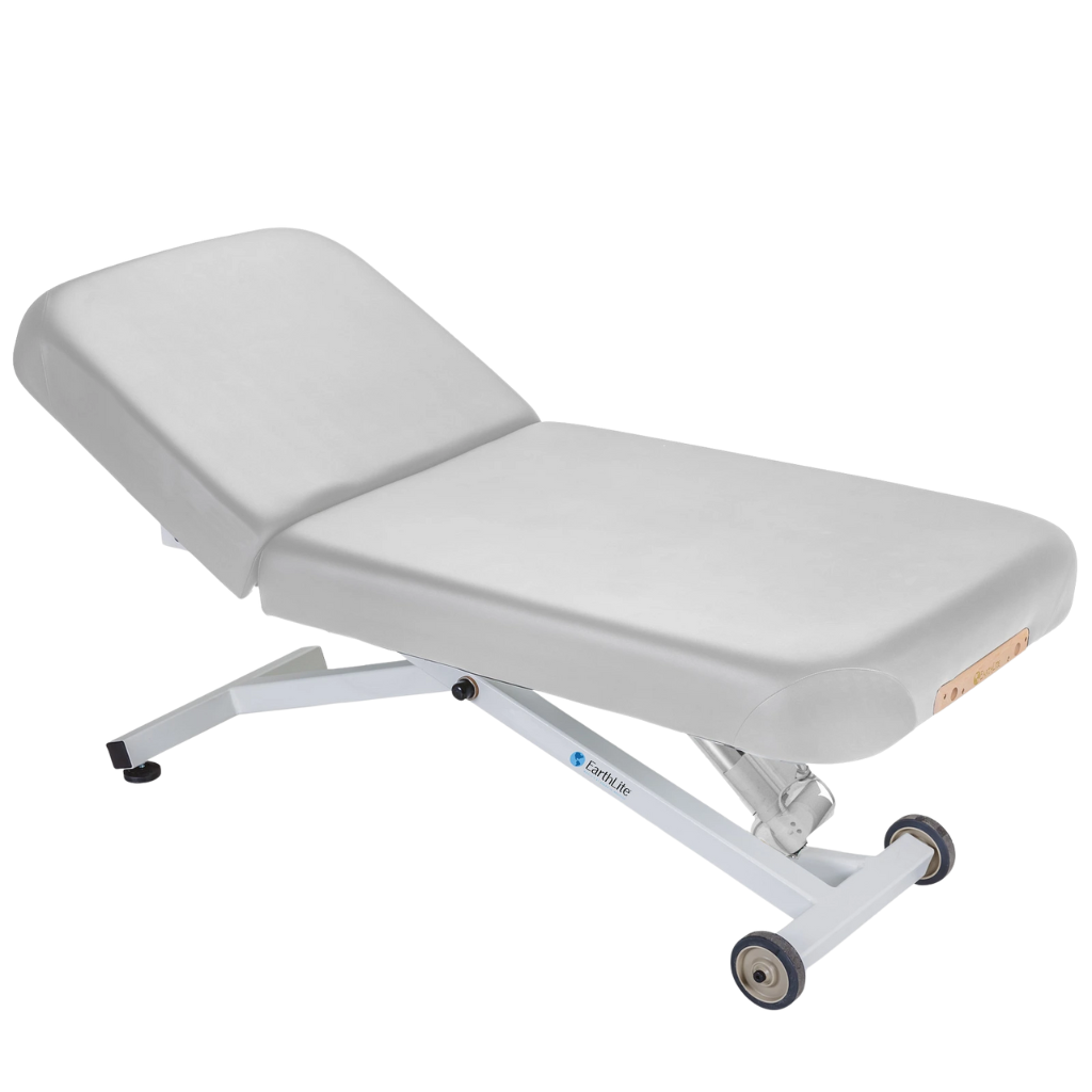 Earthlite Ellora Manual Tilt Electric Lift Table Sterling with cushioned top and adjustable base, showing manual tilt control and electric height lift, designed for professional Med Spa and wellness practices.