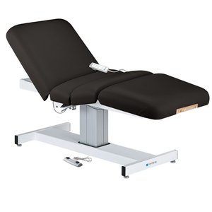Earthlite Everest Electric Salon Pedestal Electric Lift Table Black with cushioned flat top and single-column base, featuring adjustable electric functions for professional Med Spa and wellness practices.