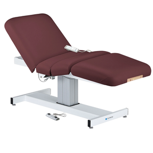 Earthlite Everest Electric Salon Pedestal Electric Lift Table Burgundy with cushioned flat top and single-column base, featuring adjustable electric functions for professional Med Spa and wellness practices.