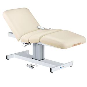 Earthlite Everest Electric Salon Pedestal Electric Lift Table Vanilla Creme with cushioned flat top and single-column base, featuring adjustable electric functions for professional Med Spa and wellness practices.
