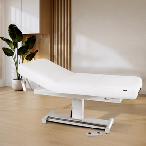 Earthlite Everest LX Tilt Top Electric Lift Table with white replaceable mattress and sturdy metal base, designed for Med Spa and IV hydration practices in setting.