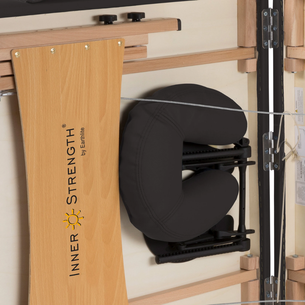 Earthlite Inner Strength Element Portable Massage Table with FacePillow attached in portable setup for wellness practices.
