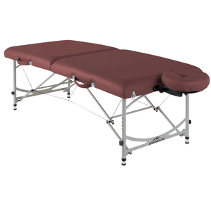 Earthlite Stronglite Versalite Pro Portable Massage Table with Burgundy upholstery and a portable design for wellness practices.