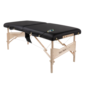 Earthlite Vibra-Therm Sports Therapy Table with black upholstery without headrest attachment for wellness practices.