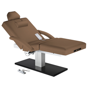 Earthlite Everest Spa Pedestal Electric Salon Table Latte with wide cushioned top and sleek single-column electric lift base in natural finish, ideal for professional Med Spa and treatment rooms.