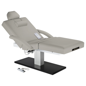 Earthlite Everest Spa Pedestal Electric Salon Table Sterling with wide cushioned top and sleek single-column electric lift base in natural finish, ideal for professional Med Spa and treatment rooms.