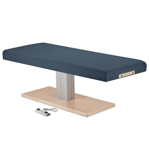 Earthlite Everest Spa Pedestal Flat Electric Table Mystic Blue with wide cushioned top and single-column wood-finish base, designed for professional spa and massage treatments.