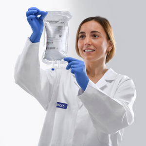 500 mL sodium chloride normal saline bag by Grifols held by nurse