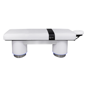 LEC INSIGNIA 2.0 ELLIPSE™ multi-purpose treatment table with a replaceable mattress, ergonomic cushioning, and a durable design ideal for Med Spas and wellness practices illustrating the side view with the Strata Facepillow.