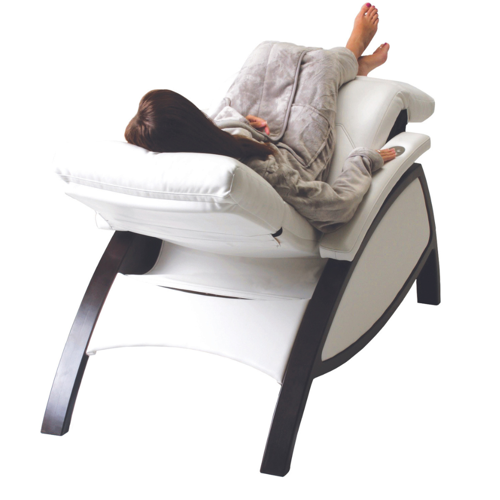 LEC ZG Dream Lounger Salt Room Edition with model demonstrating zero gravity reclining position and metal leg base.