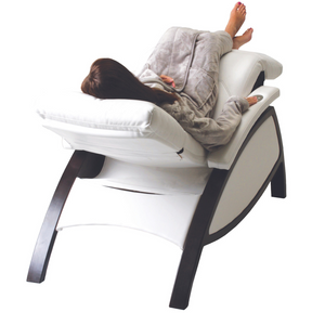 LEC ZG Dream Lounger Salt Room Edition with model demonstrating zero gravity reclining position and metal leg base.
