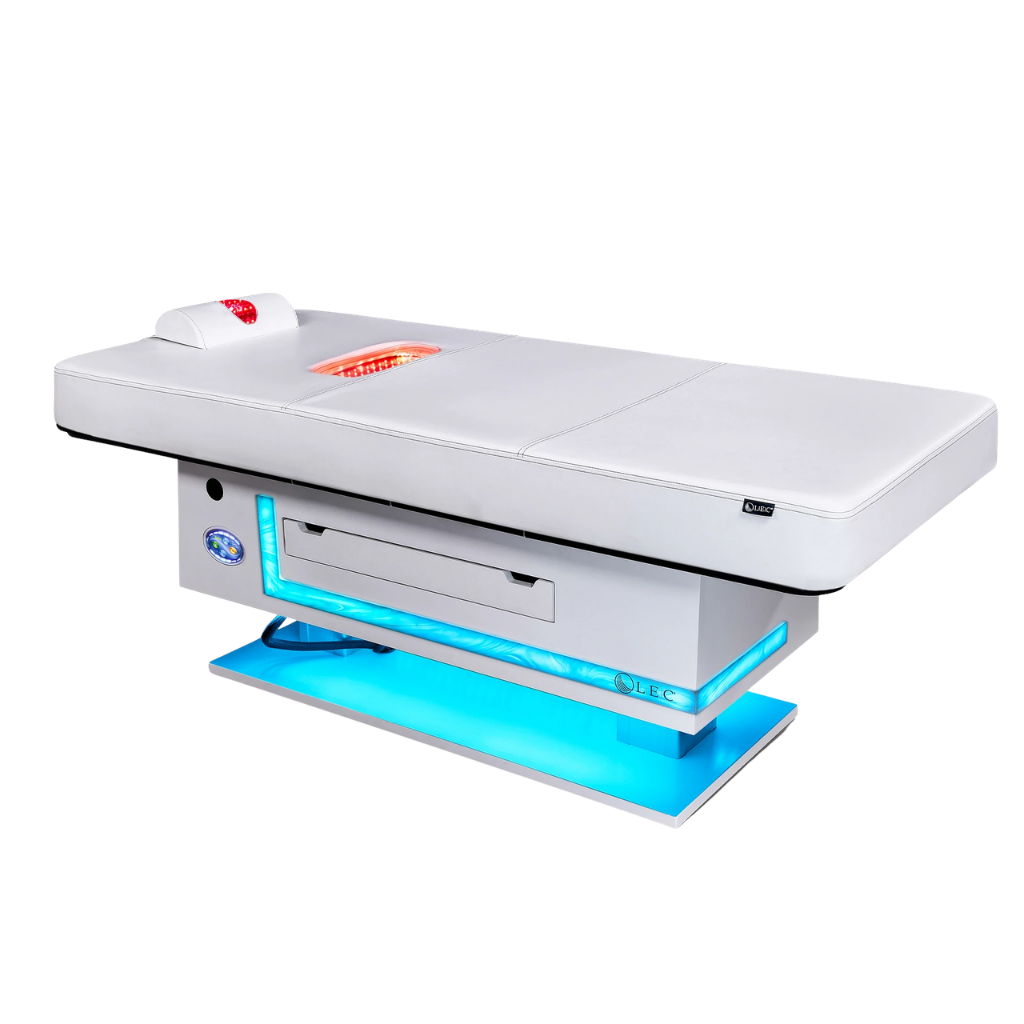 Radiance PT Pulsed LED Light Therapy Treatment Table with neck roll and back panel lit.