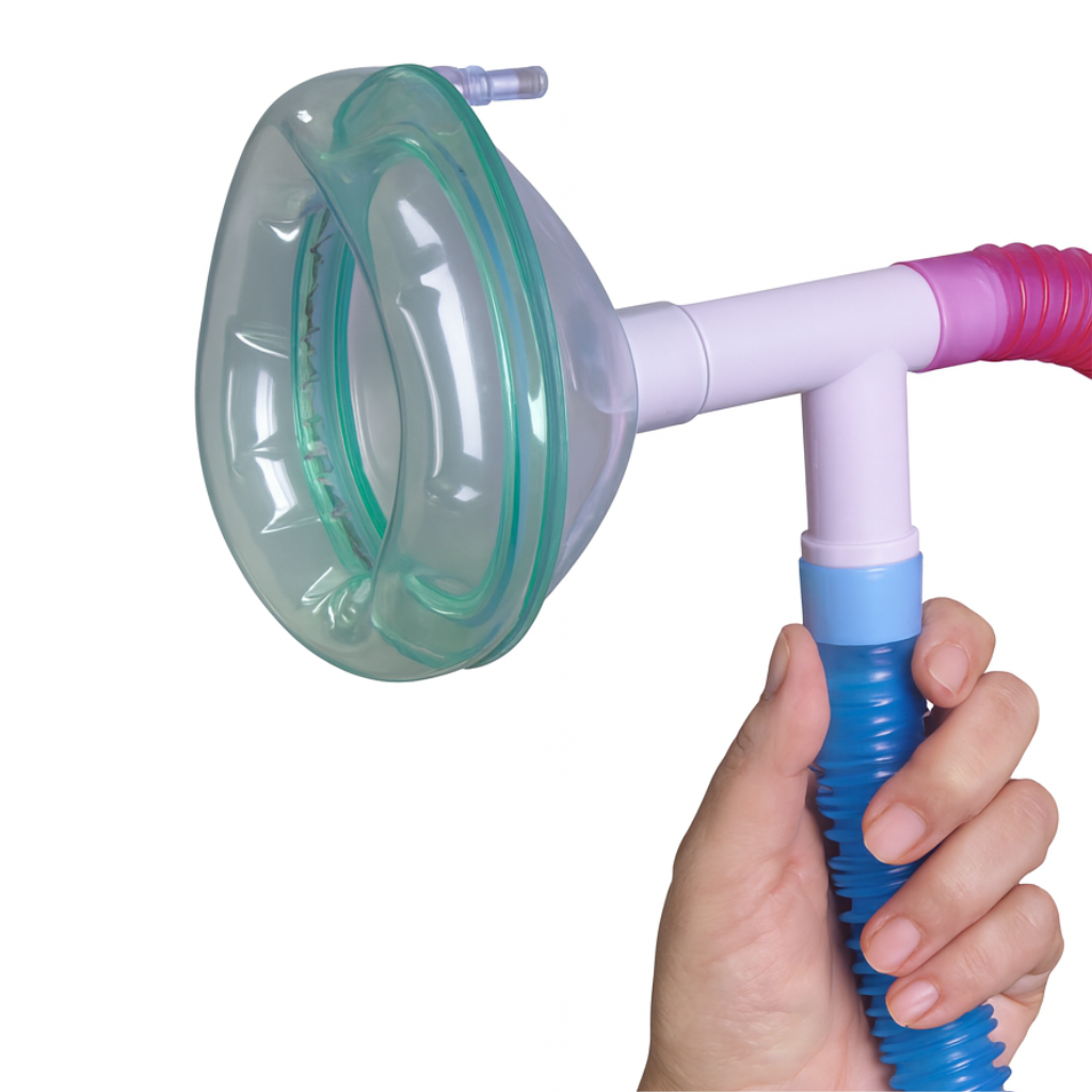 Hand holding Nitronox nitrous oxide medical mask with green  outline, coneected to a breathing circuit on a white background