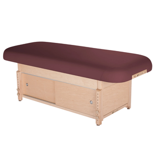 Earthlite Sedona Flat Top Spa & Massage Table with Burgundy upholstery and enclosed cabinet base for storage in med spa and medical wellness practices.