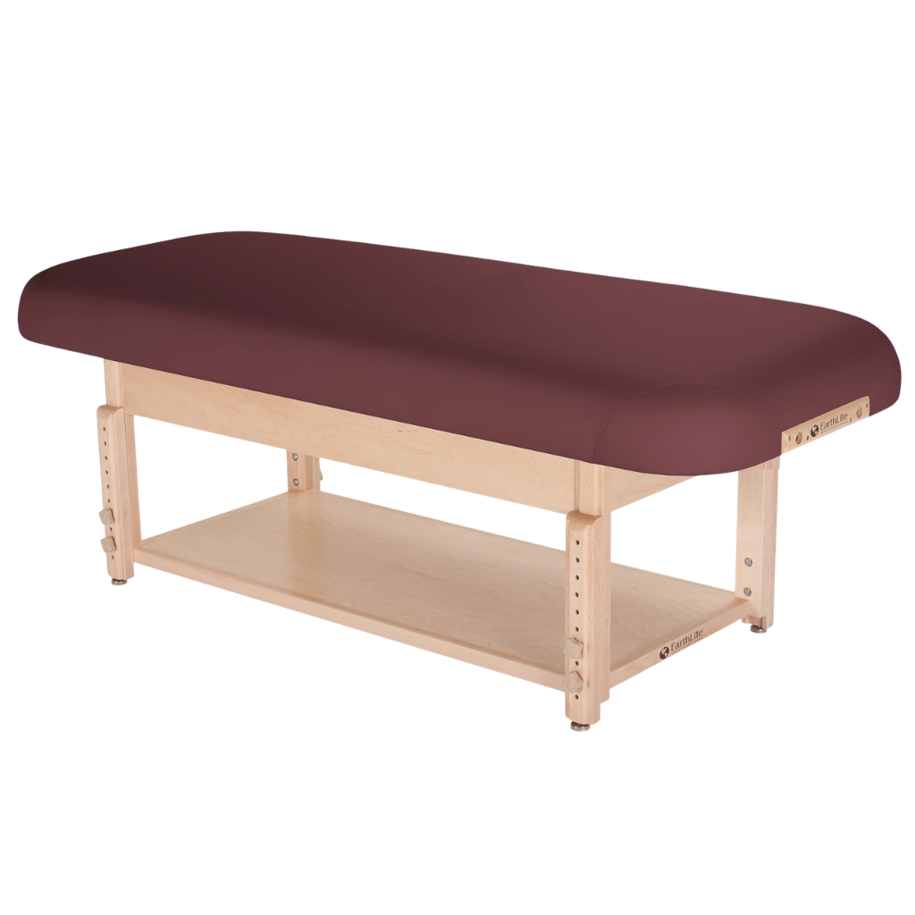 Earthlite Sedona Flat Top Spa & Massage Table with Burgundy upholstery and open shelf base for storage in med spa and medical wellness practices.