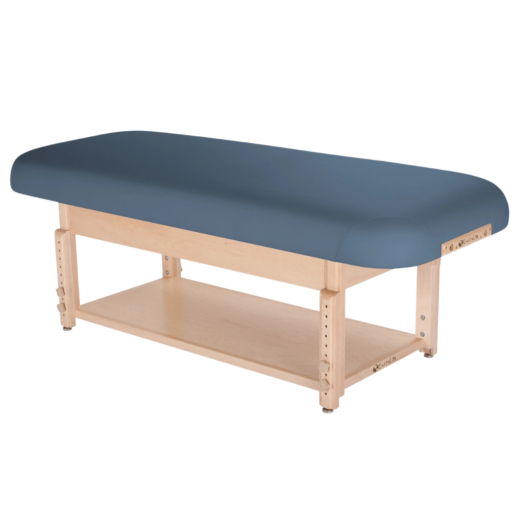 Earthlite Sedona Flat Top Spa & Massage Table with Mystic Blue upholstery and open shelf base for storage in med spa and medical wellness practices.