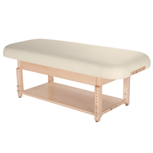 Earthlite Sedona Flat Top Spa & Massage Table with Vanilla Creme upholstery and open shelf base for storage in med spa and medical wellness practices.