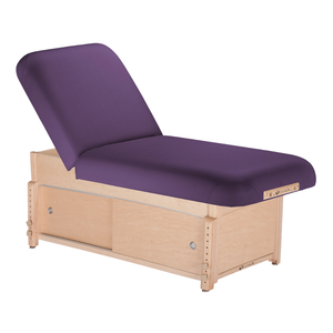 Earthlite Sedona Manual Tilt Massage Table with Amethyst upholstery and enclosed cabinet base for storage in med spa and medical wellness practices.