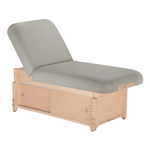 Earthlite Sedona Manual Tilt Massage Table with Sterling upholstery and enclosed cabinet base for storage in med spa and medical wellness practices.