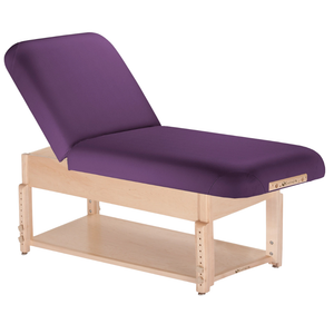 Earthlite Sedona Manual Tilt Massage Table with Amethyst upholstery and open shelf base for storage in med spa and medical wellness practices.