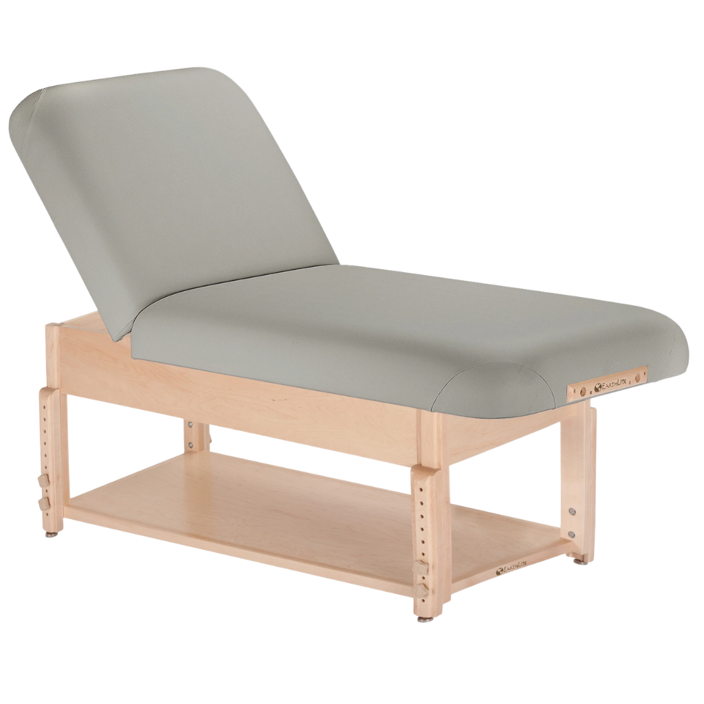 Earthlite Sedona Manual Tilt Massage Table with sterling upholstery and open shelf base for storage in med spa and medical wellness practices.