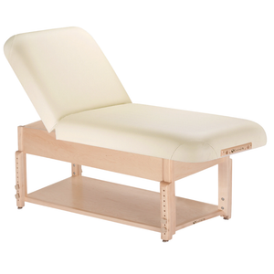 Earthlite Sedona Manual Tilt Massage Table with Vanilla Creme upholstery and open shelf base for storage in med spa and medical wellness practices.