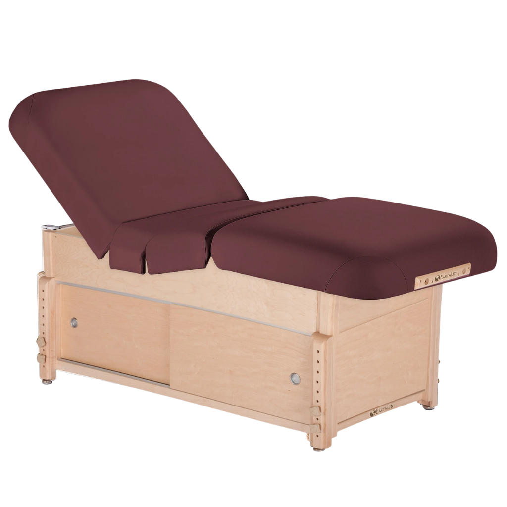 Earthlite Sedona Pneumatic Salon Massage Table with Burgundy upholstery and open cabinet base for storage in med spa and medical wellness practices.