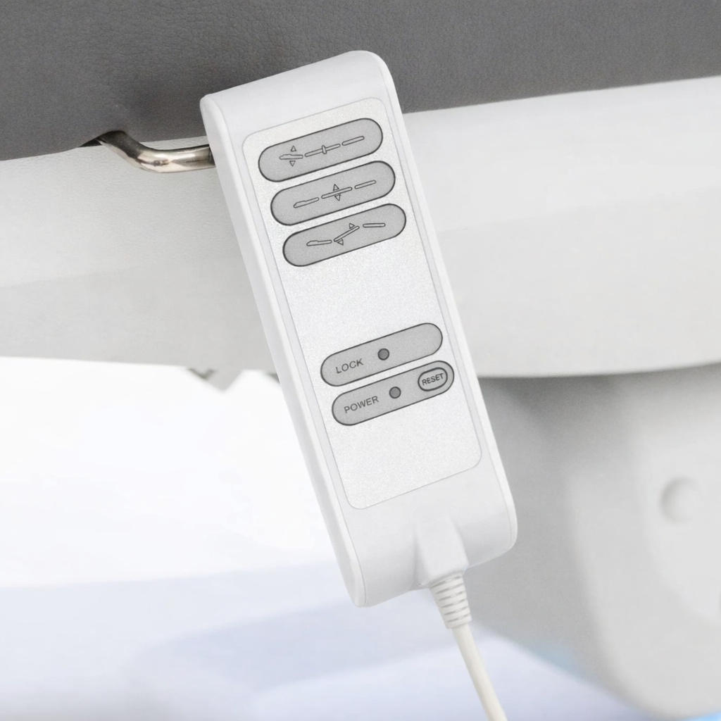 Silverfox Wired Hand Controller For Med Spa Chairs hanging on the clip of a med spa chair