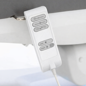 Silverfox Wired Hand Controller For Med Spa Chairs hanging on the clip of a med spa chair