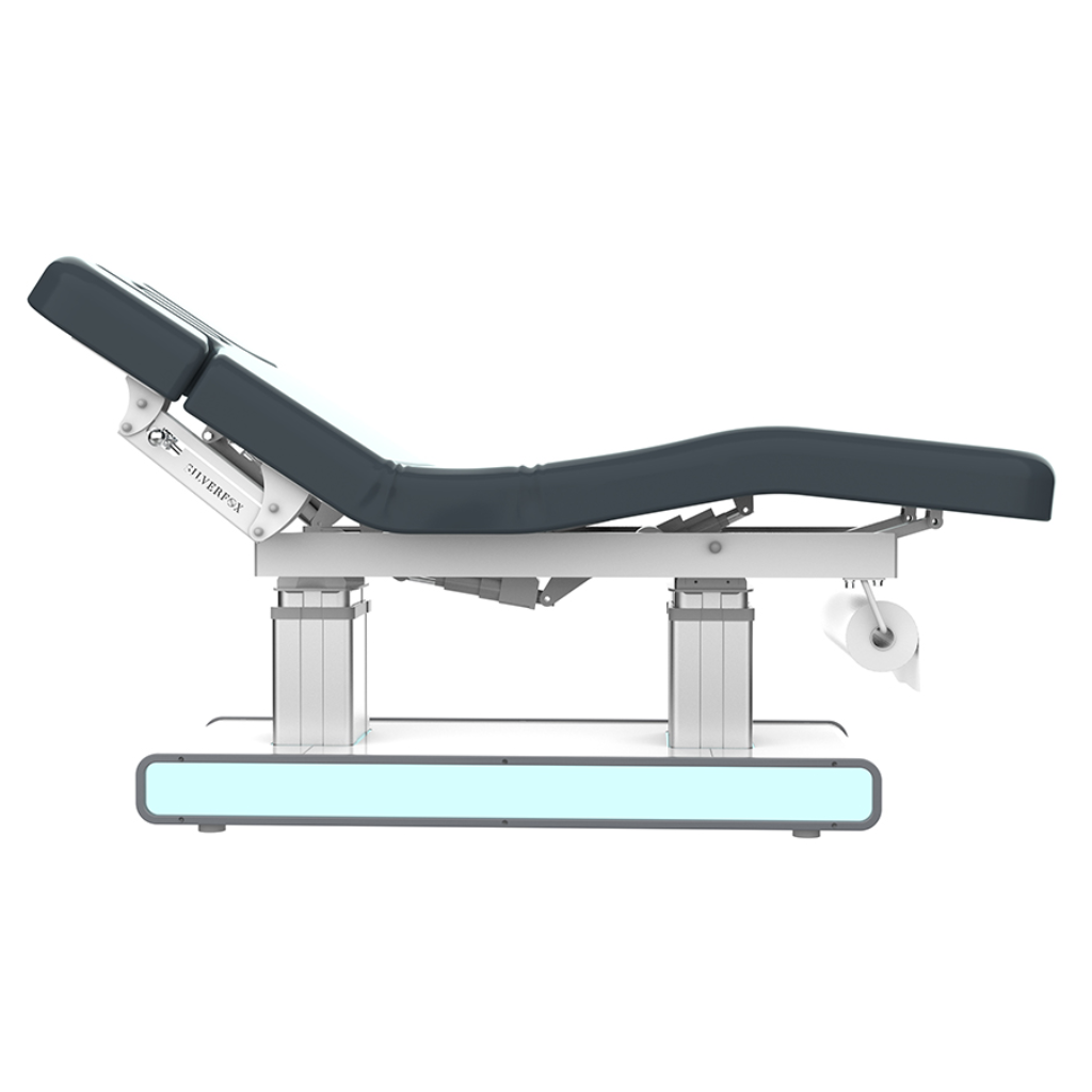 Left view of Silverfox Serene Wellness & Spa Table (2275)  with adjustable backrest, footrest, and armrests, featuring a sturdy metal base, smooth vegan leather upholstery, and a comfortable headrest for facials and spa treatments.