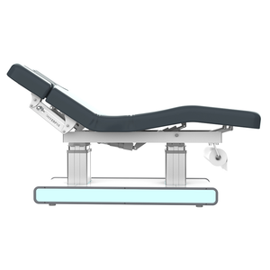 Left view of Silverfox Serene Wellness & Spa Table (2275)  with adjustable backrest, footrest, and armrests, featuring a sturdy metal base, smooth vegan leather upholstery, and a comfortable headrest for facials and spa treatments.