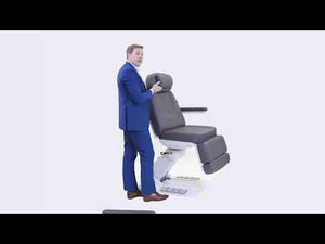 A person demonstrates the Upgrade Medical Spa Chair (2246EBN), showcasing its rotation, foot pedal controls for hands-free adjustments, and memory function for customized positioning.